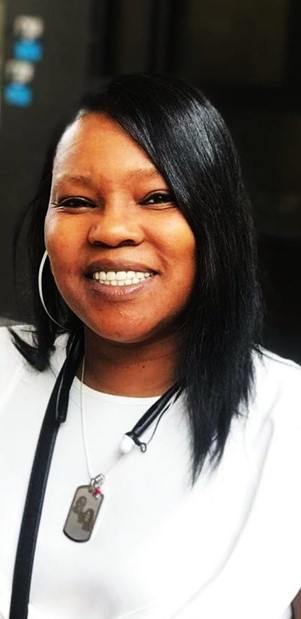 Trina M. Jackson smiling, white blouse